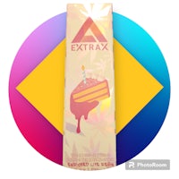 a box of extrax with a cake on it